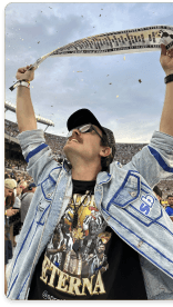 Man celebrating at a stadium