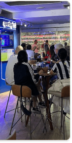 People at a sporting event bar